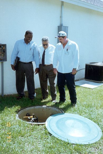 Carvin Malone and fellow engineers inspecting an area